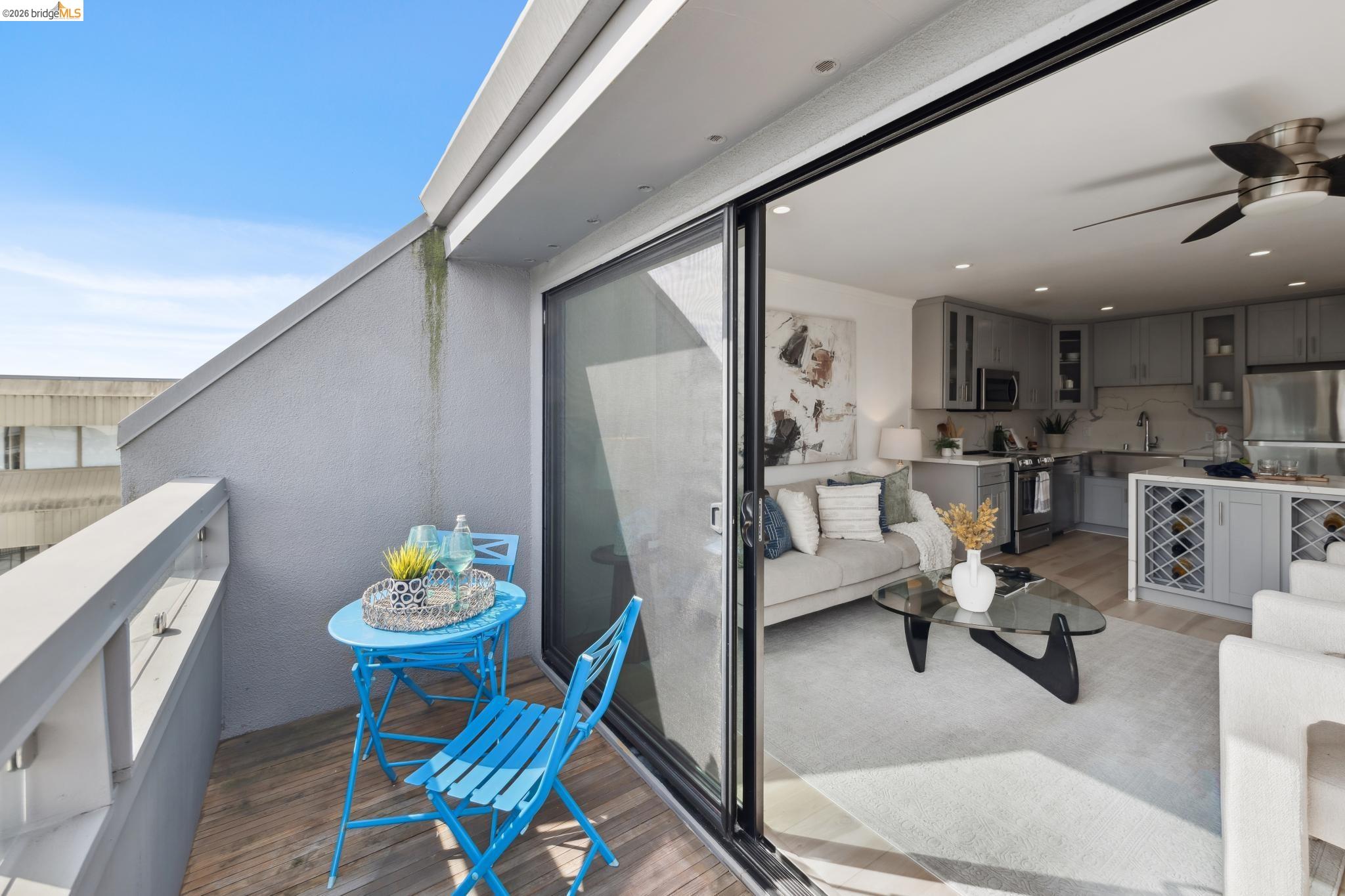 7 Embarcadero, Unit 204 Oakland, CA 94607 - Photo 16 of 27 Balcony featuring a ceiling fan and area for grilling