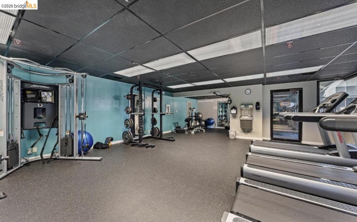 7 Embarcadero, Unit 204 Oakland, CA 94607 - Photo 24 of 27 Workout area featuring a paneled ceiling