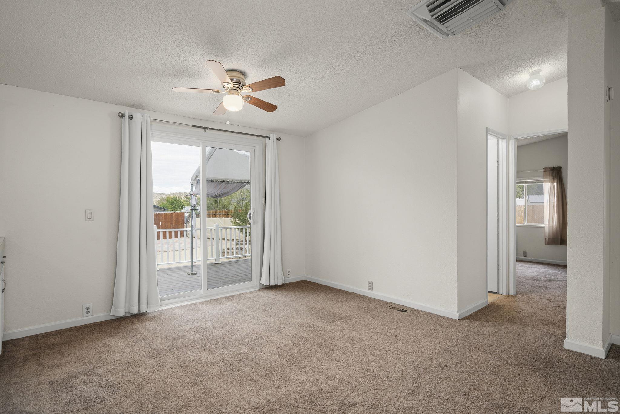 1815 Collins Circle Reno, NV 89506 - Photo 13 of 40 an empty room with fan and entrance