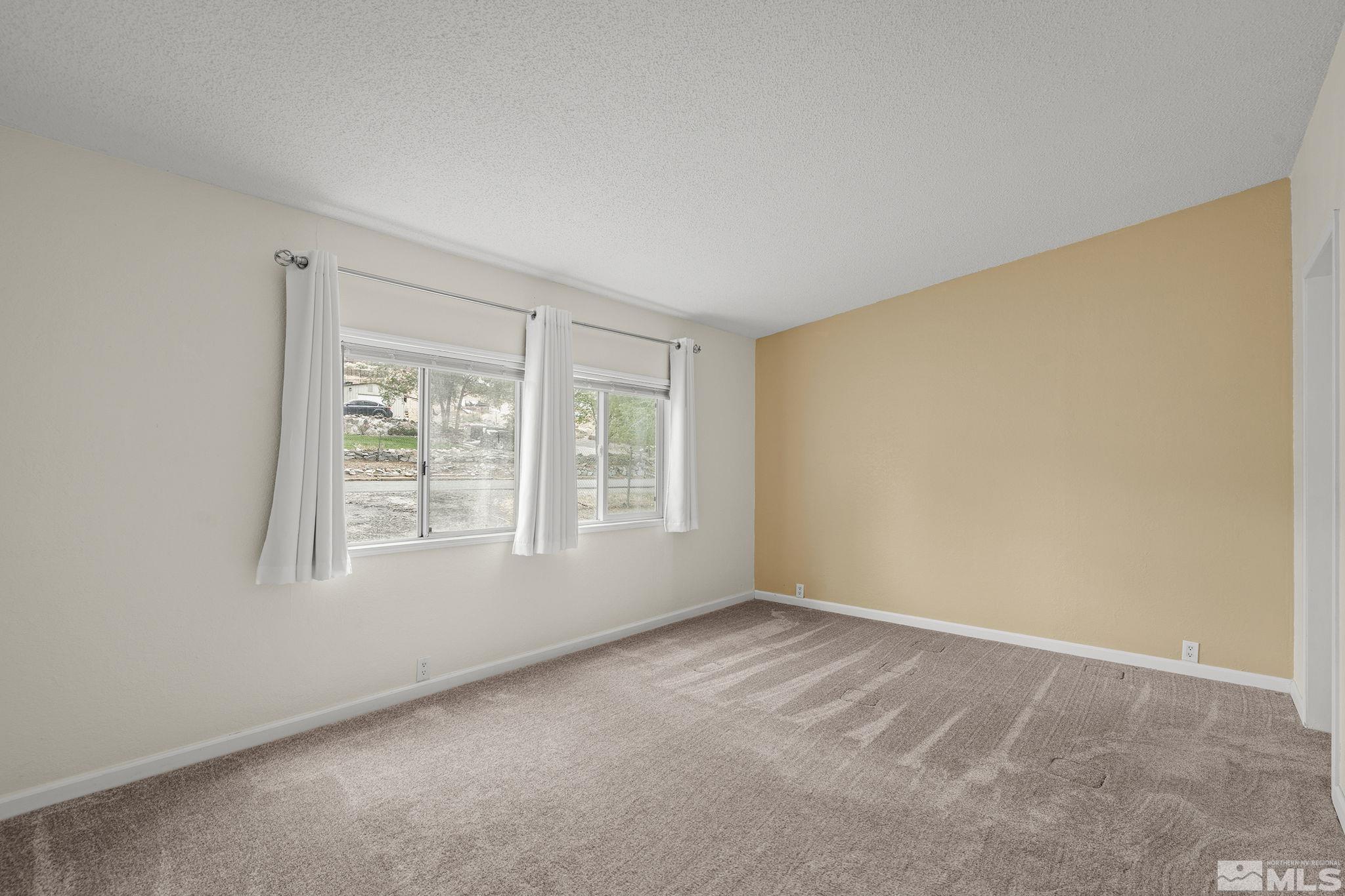 1815 Collins Circle Reno, NV 89506 - Photo 19 of 40 an empty room with a window