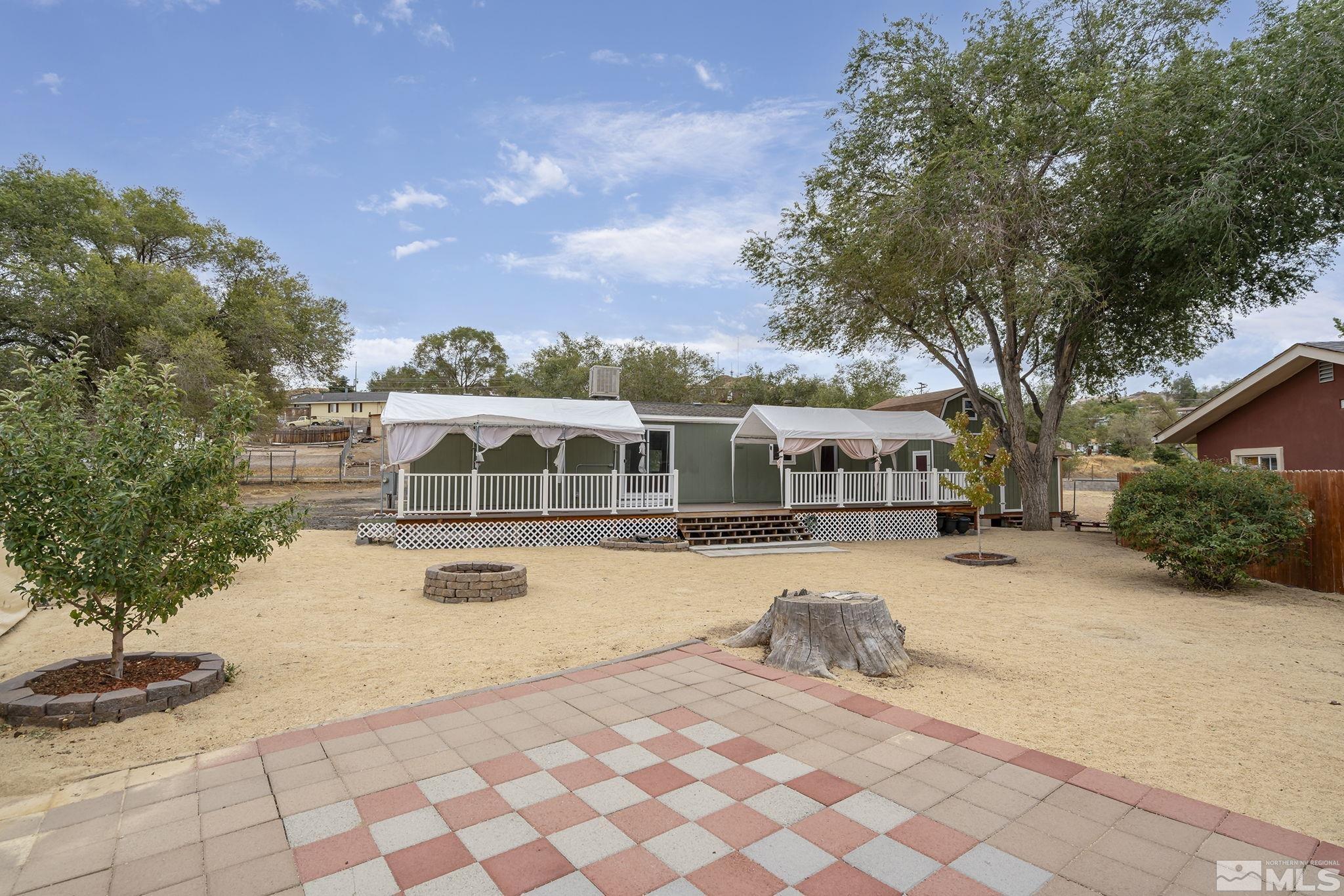 1815 Collins Circle Reno, NV 89506 - Photo 27 of 40 a view of a house with backyard and sitting area