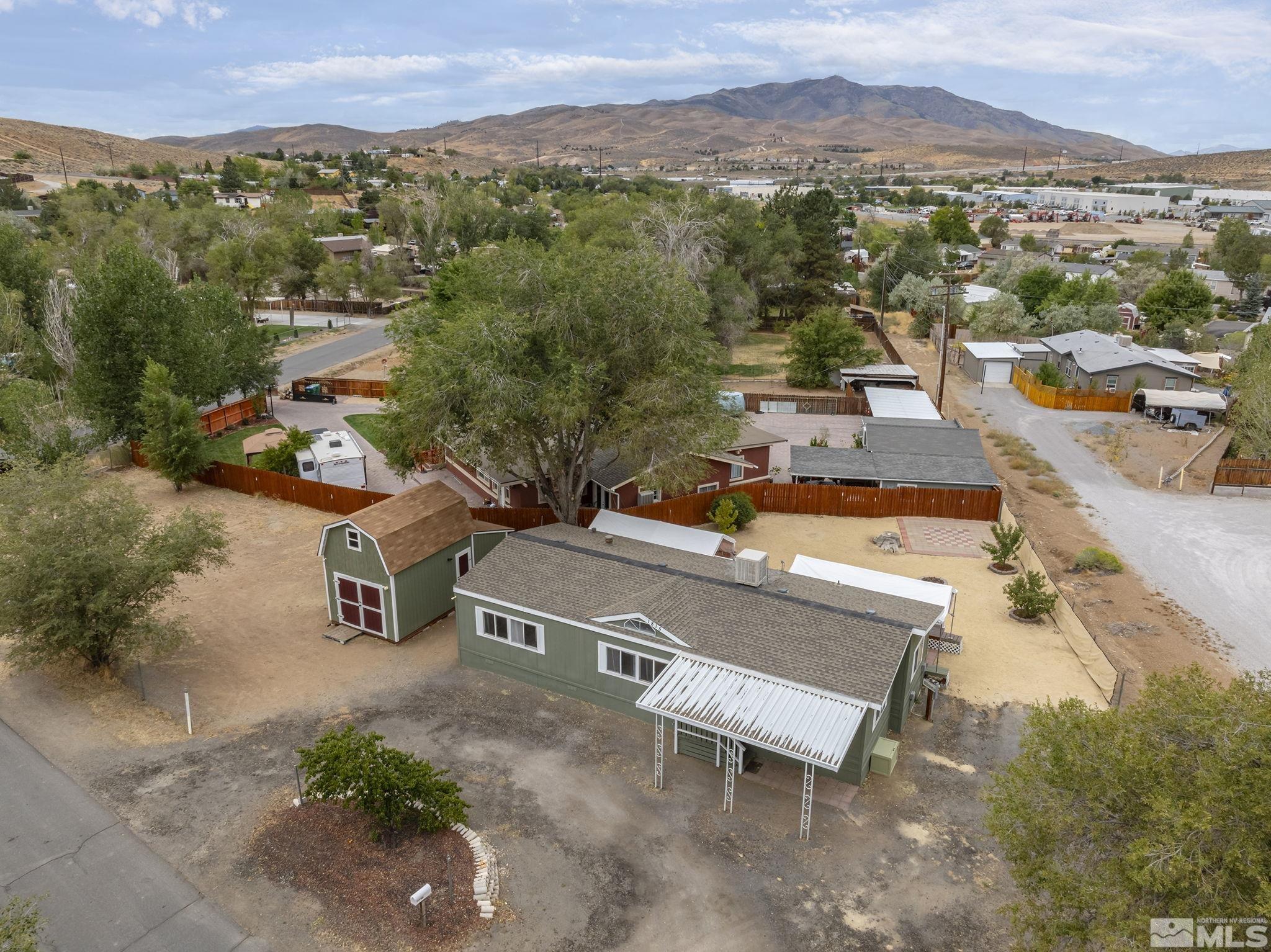1815 Collins Circle Reno, NV 89506 - Photo 3 of 40 an aerial view of a swimming pool with mountain view