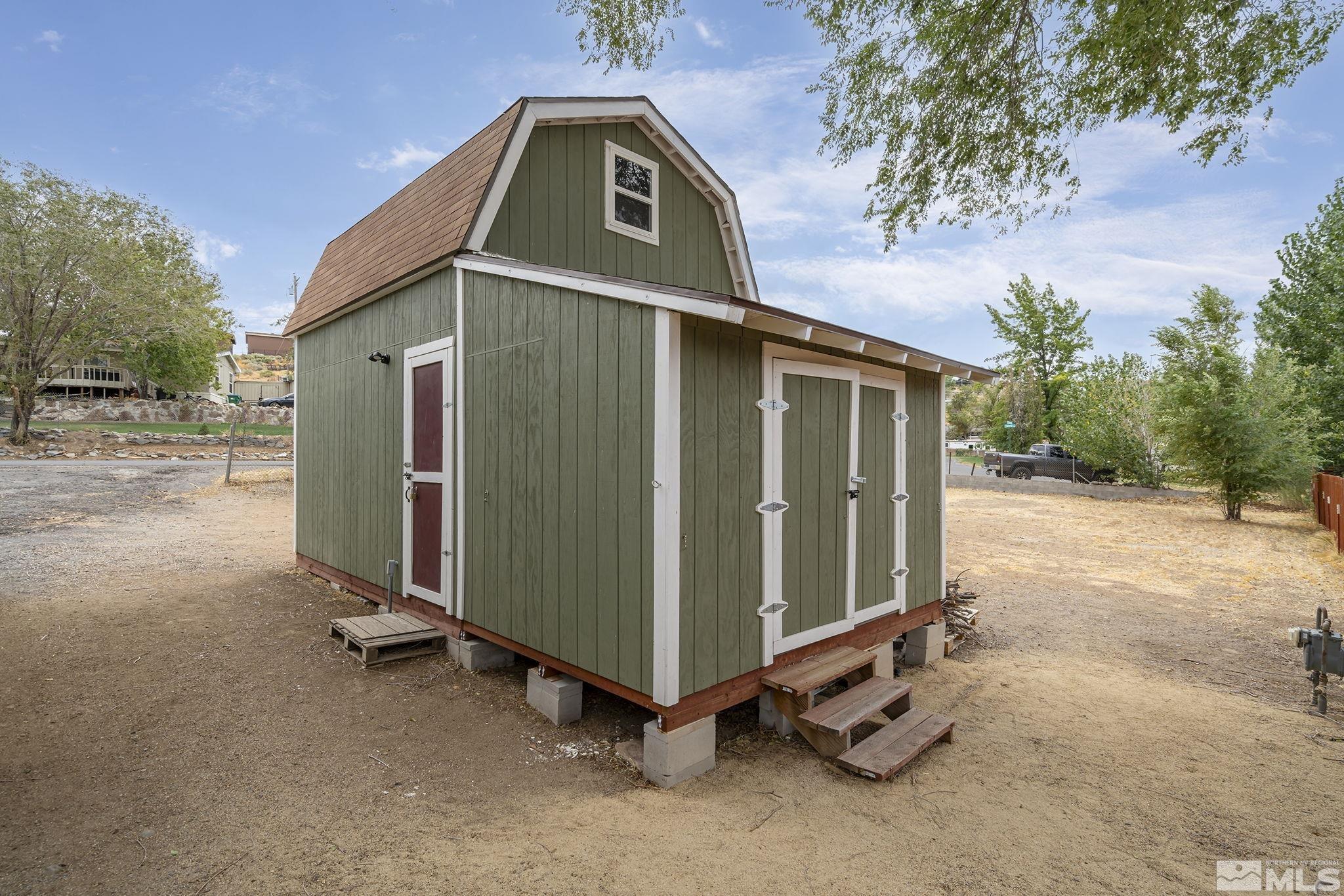 1815 Collins Circle Reno, NV 89506 - Photo 32 of 40 a view of a small house with a yard