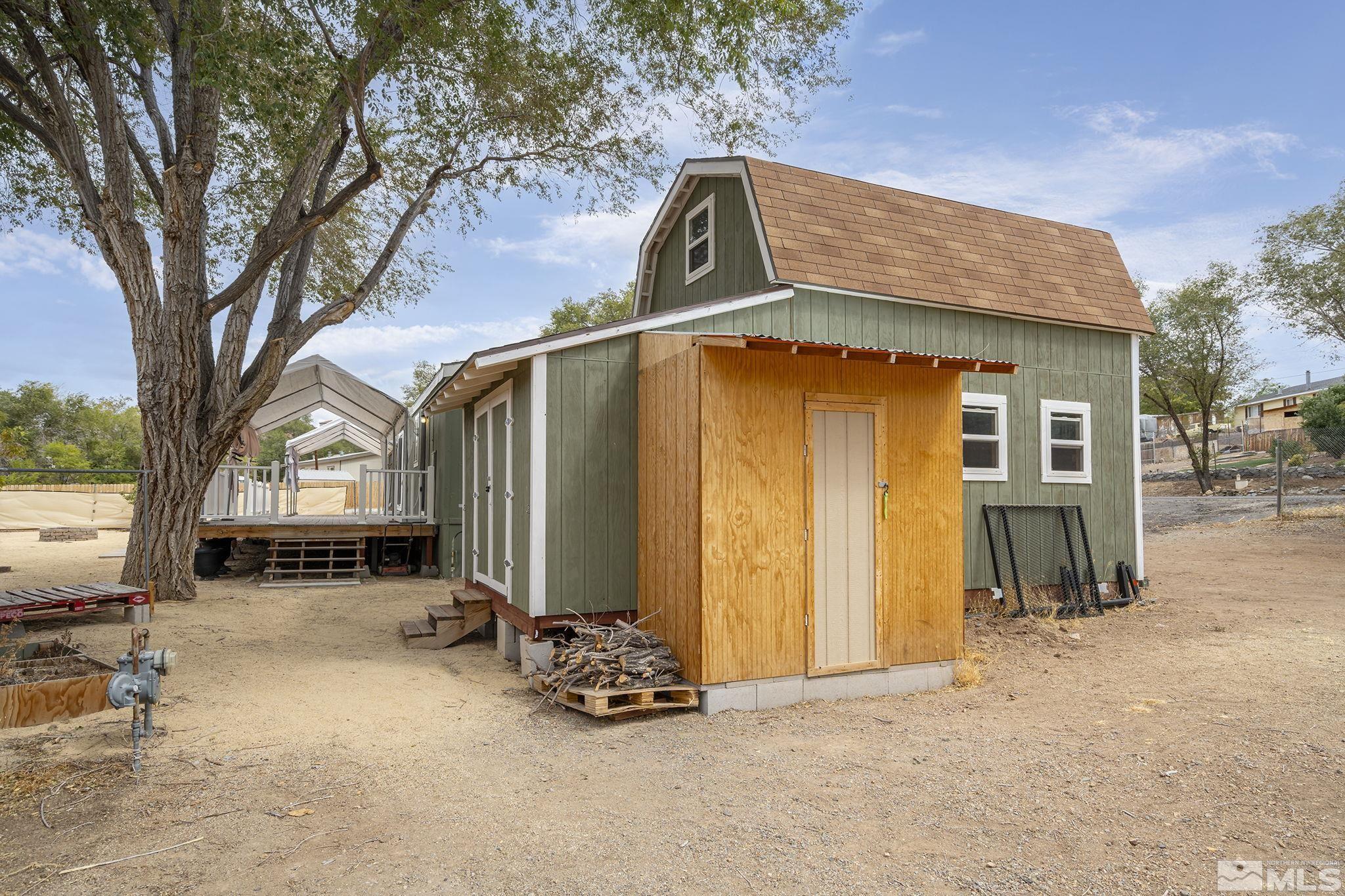 1815 Collins Circle Reno, NV 89506 - Photo 34 of 40 a backyard of a house with barbeque oven and outdoor seating