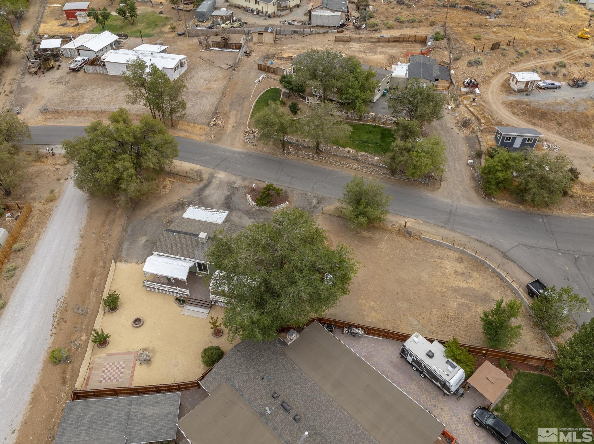 1815 Collins Circle Reno, NV 89506 - Photo 38 of 40 an aerial view of a house with a yard and lake view