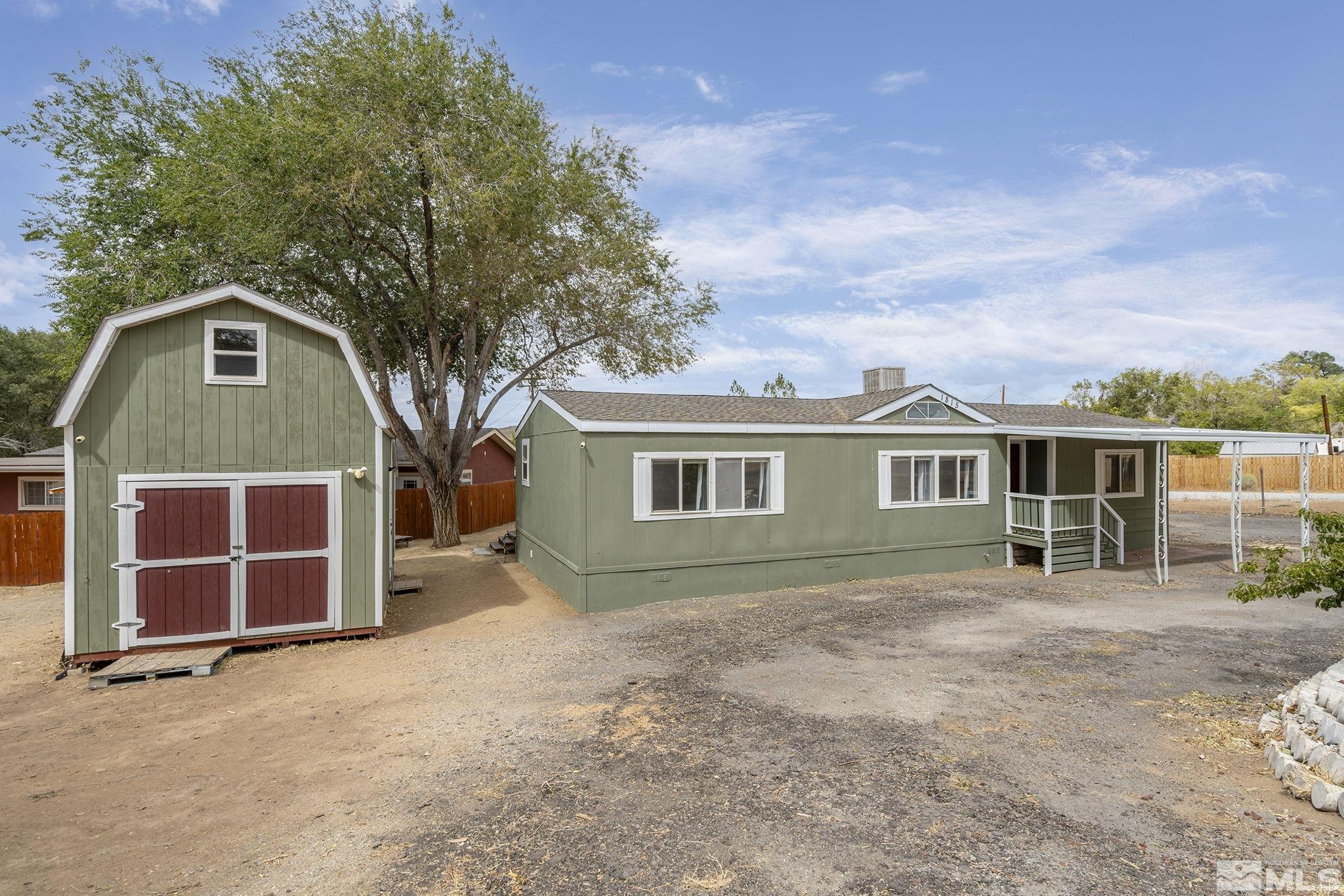 1815 Collins Circle Reno, NV 89506 - Photo 5 of 40 a front view of a house with a yard