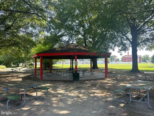 a view of a park with swings and slides