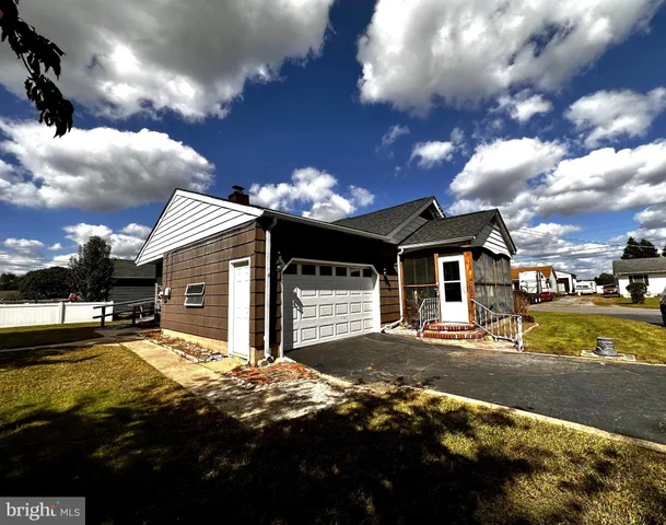 a view of a house with a big yard