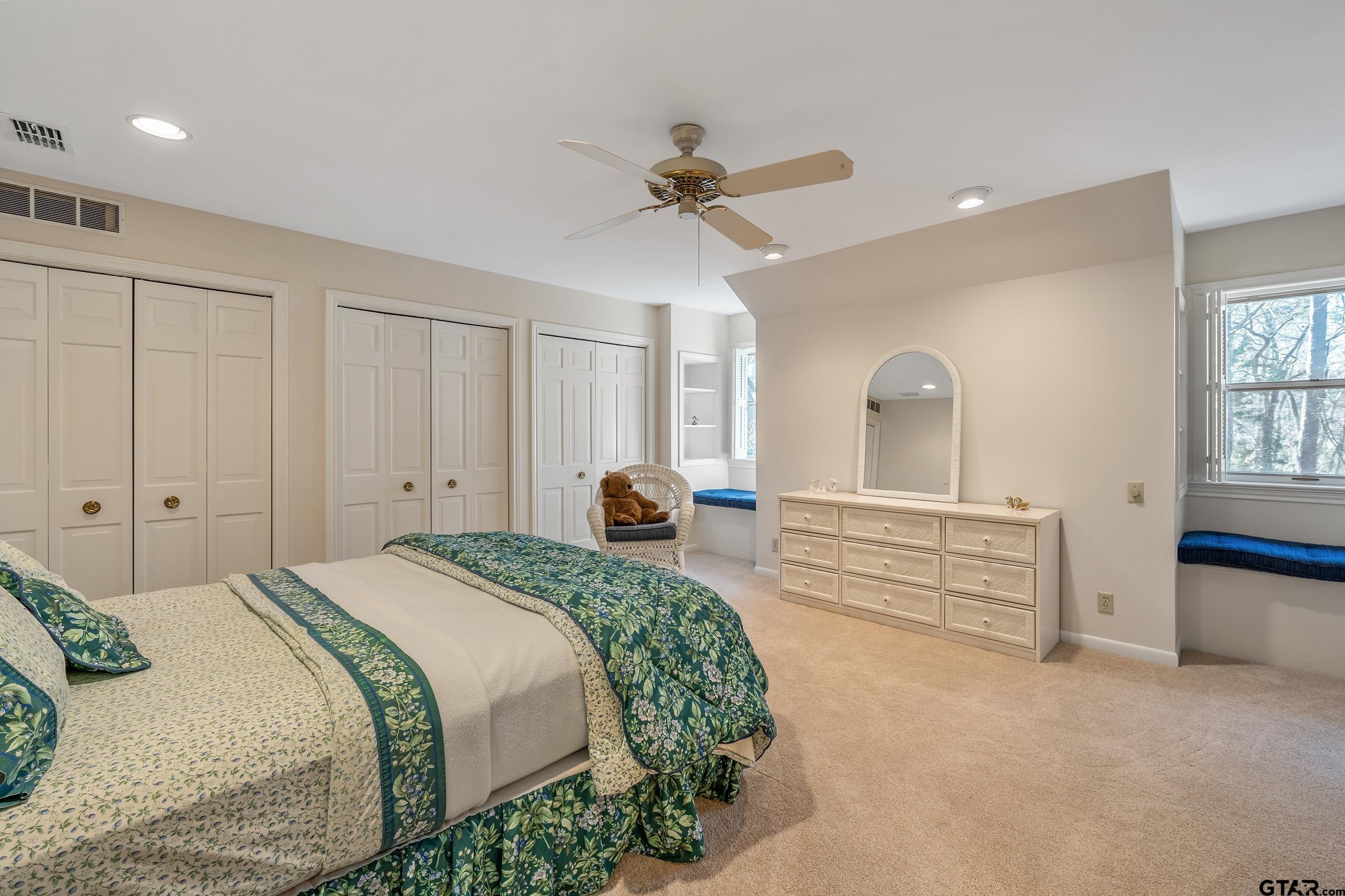 628 Wilder Way Tyler, TX 75703 - Photo 32 of 46 a bedroom with a bed and a chandelier