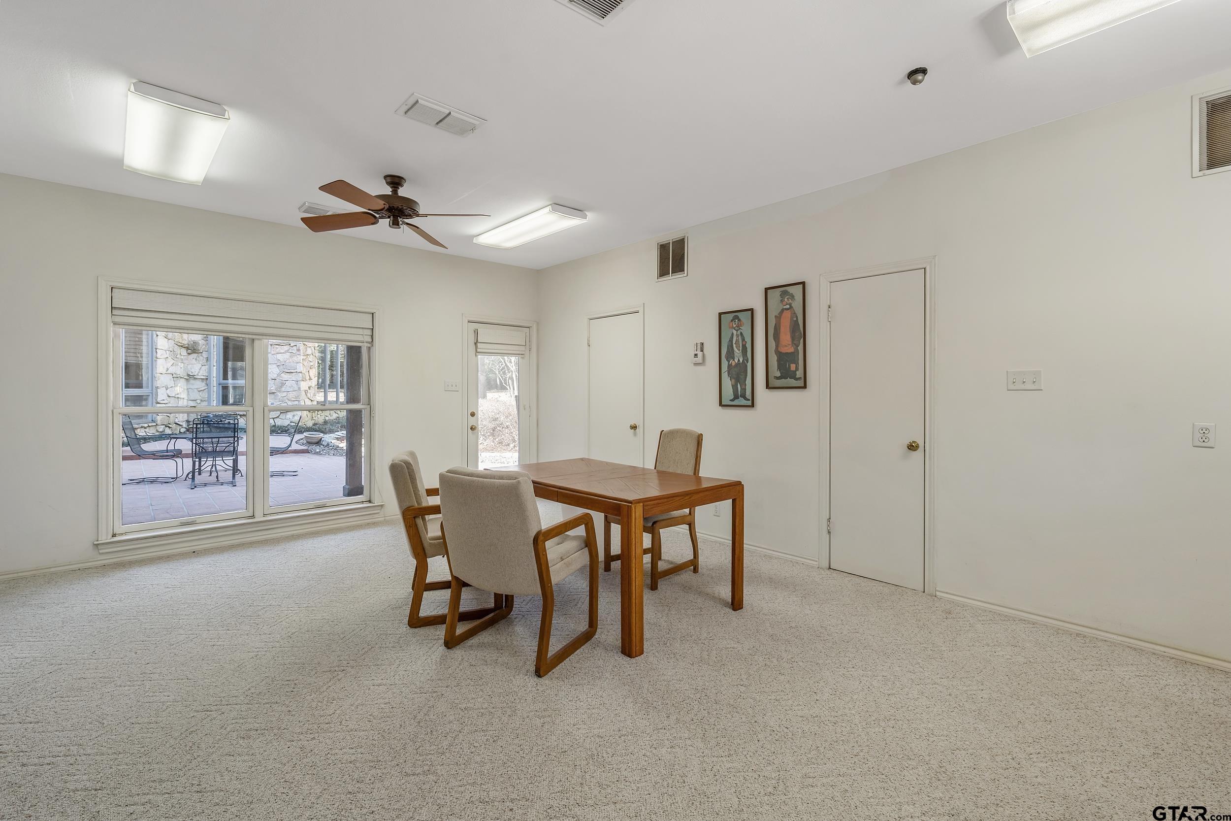 628 Wilder Way Tyler, TX 75703 - Photo 44 of 46 a view of a dining room with furniture and a window