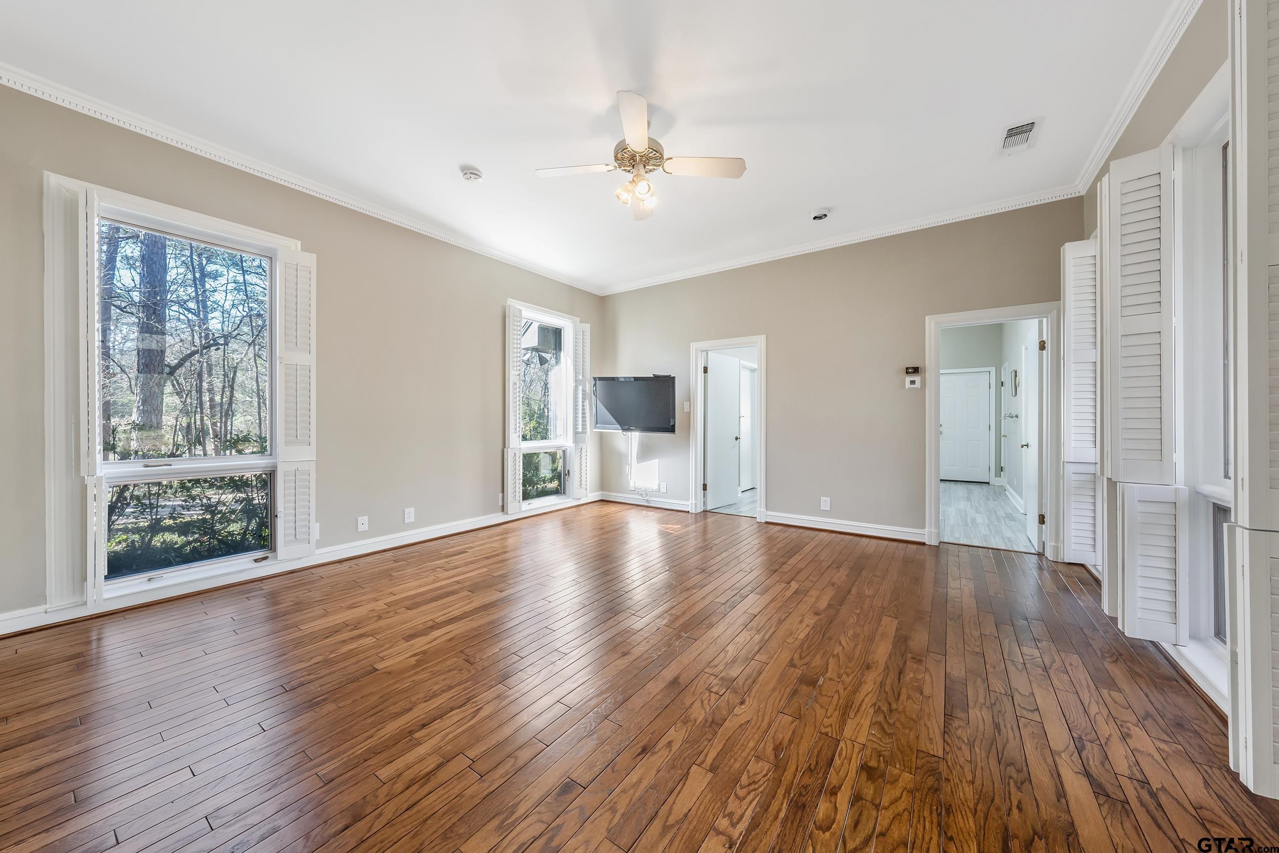 628 Wilder Way Tyler, TX 75703 - Photo 9 of 46 a view of empty room with wooden floor and fireplace
