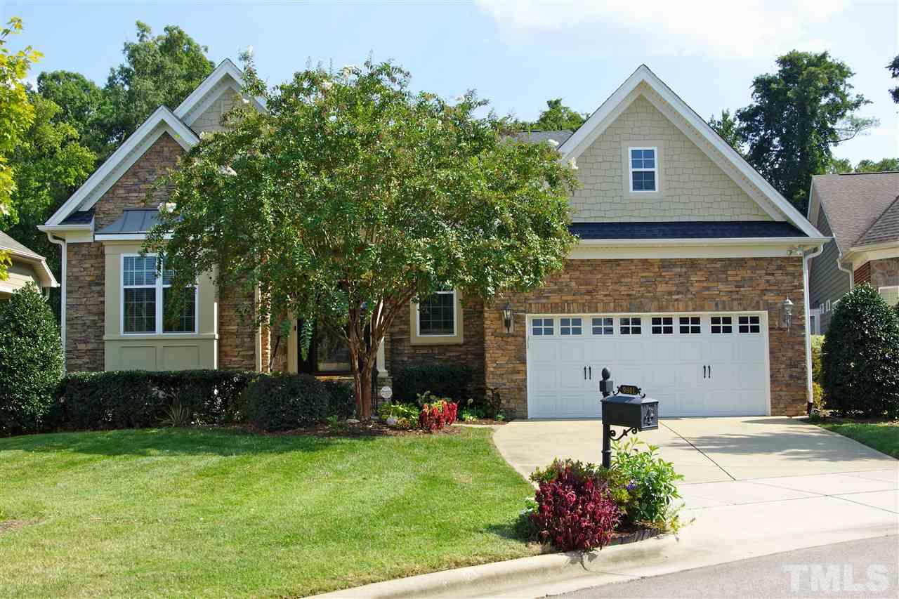 9801 Crooked Tree Lane Raleigh, NC 27617 - Photo 15 of 19 a front view of a house with a garden