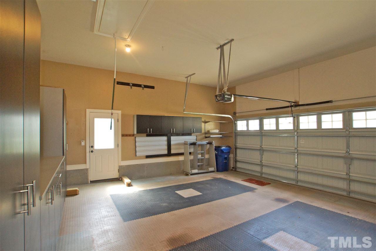 9801 Crooked Tree Lane Raleigh, NC 27617 - Photo 17 of 19 a view of a room with racks on the wall