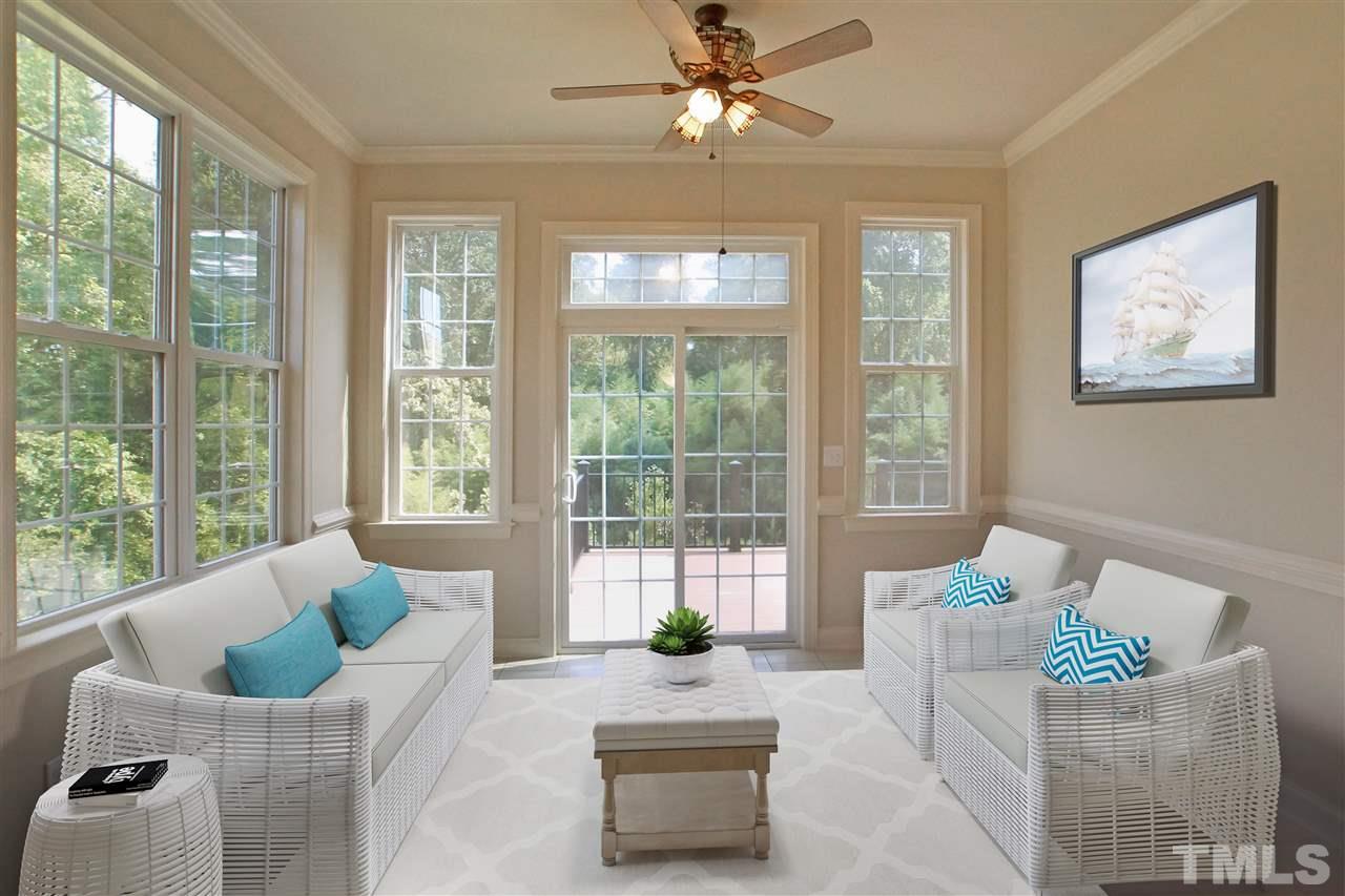 9801 Crooked Tree Lane Raleigh, NC 27617 - Photo 3 of 19 a living room with furniture and large windows