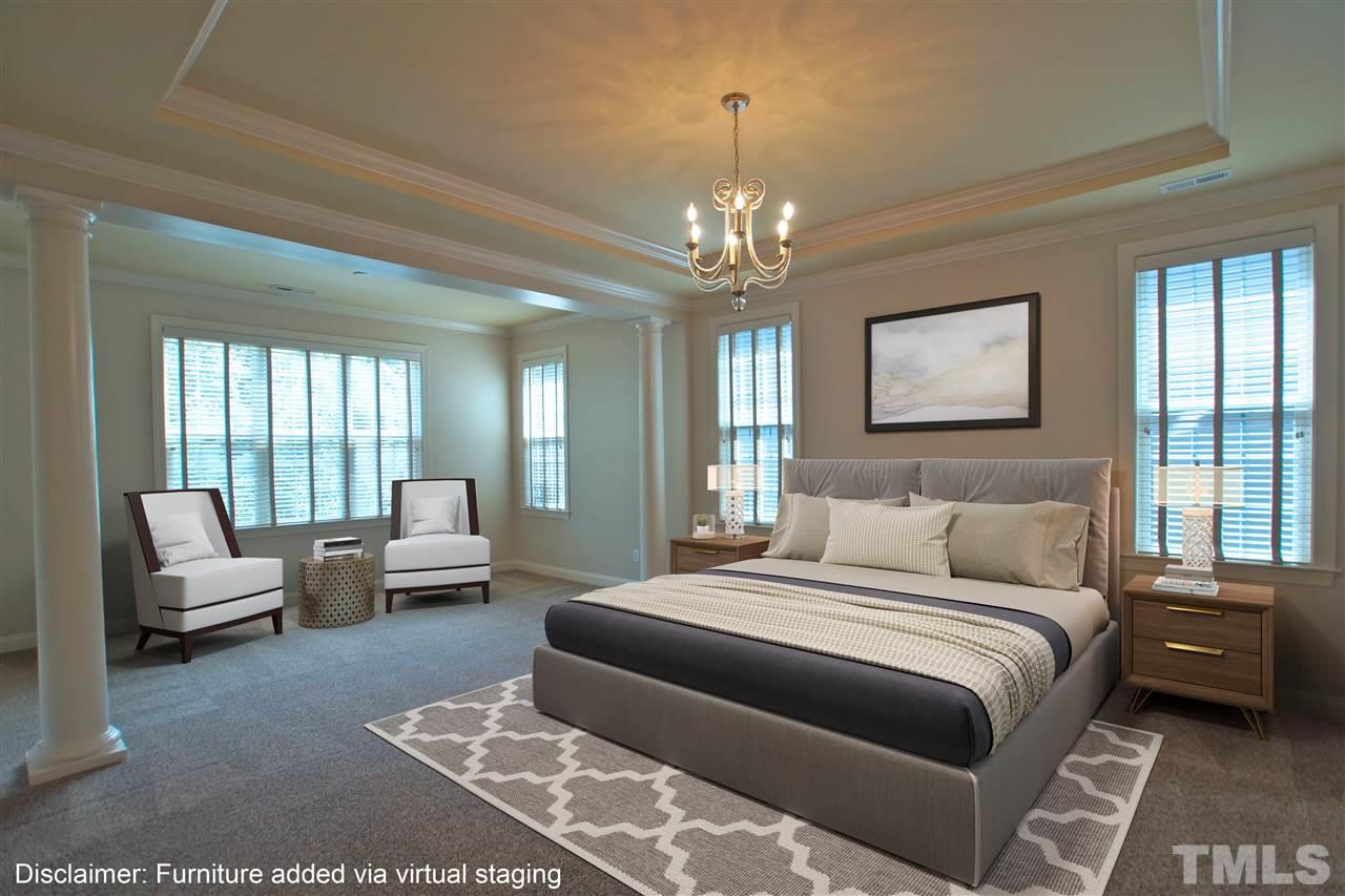 9801 Crooked Tree Lane Raleigh, NC 27617 - Photo 5 of 19 a bedroom with a large bed and a couch