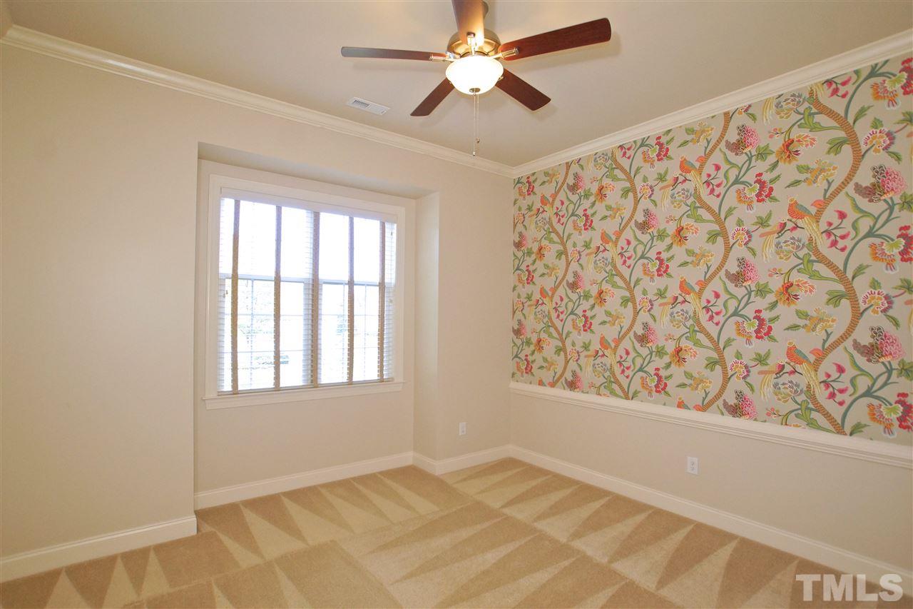 9801 Crooked Tree Lane Raleigh, NC 27617 - Photo 6 of 19 a view of an empty room with a window