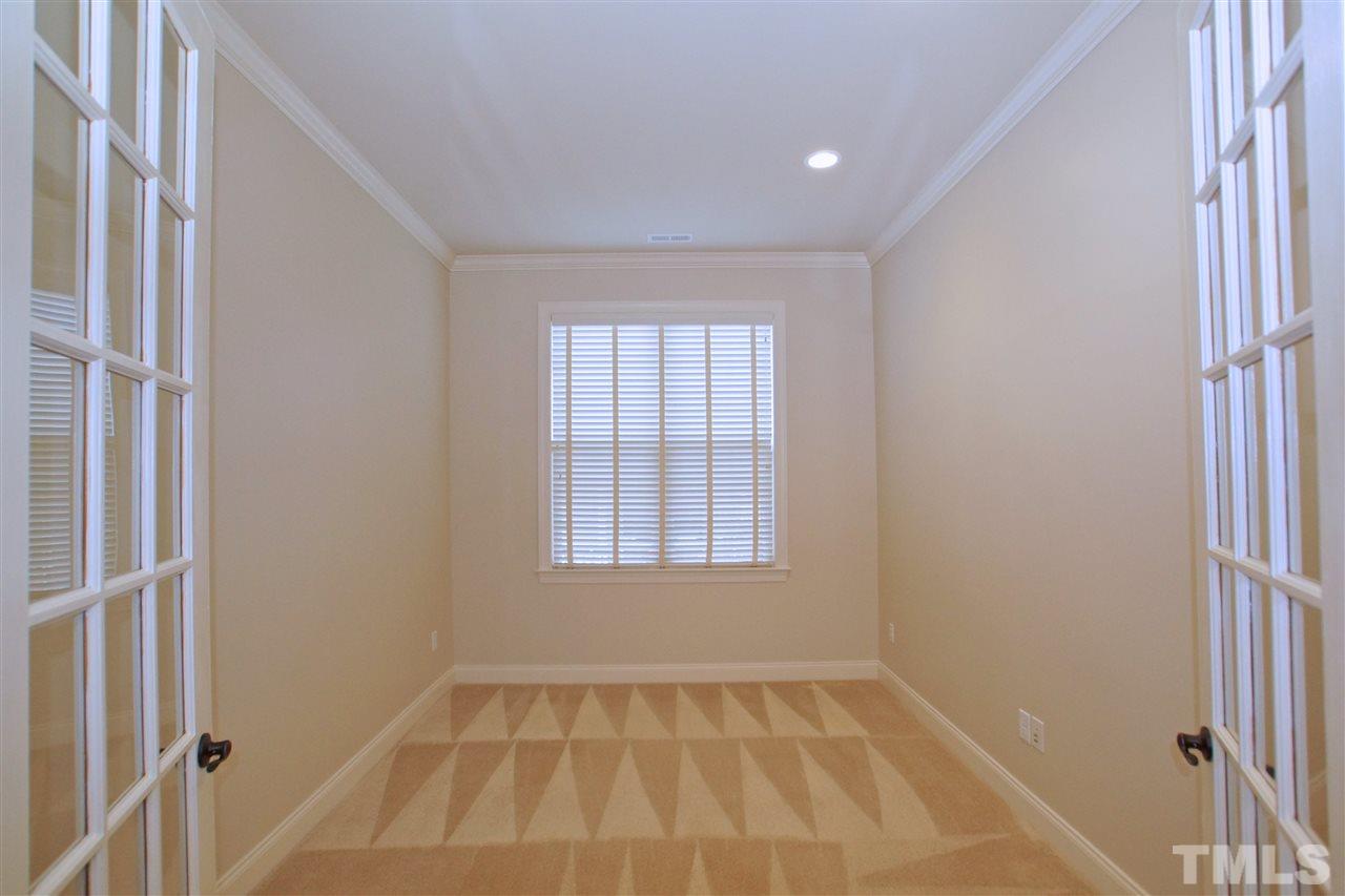 9801 Crooked Tree Lane Raleigh, NC 27617 - Photo 7 of 19 a view of an empty room with a window