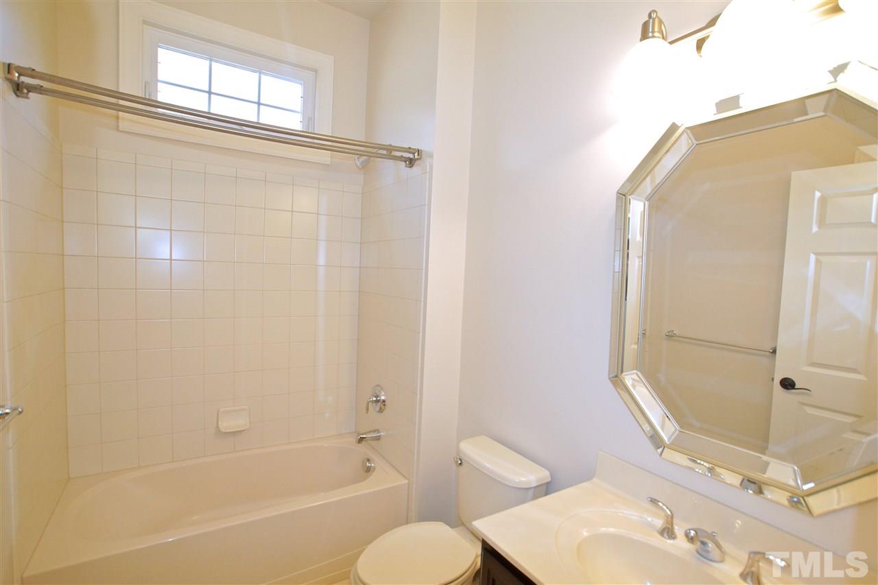 9801 Crooked Tree Lane Raleigh, NC 27617 - Photo 9 of 19 a bathroom with a sink toilet and shower