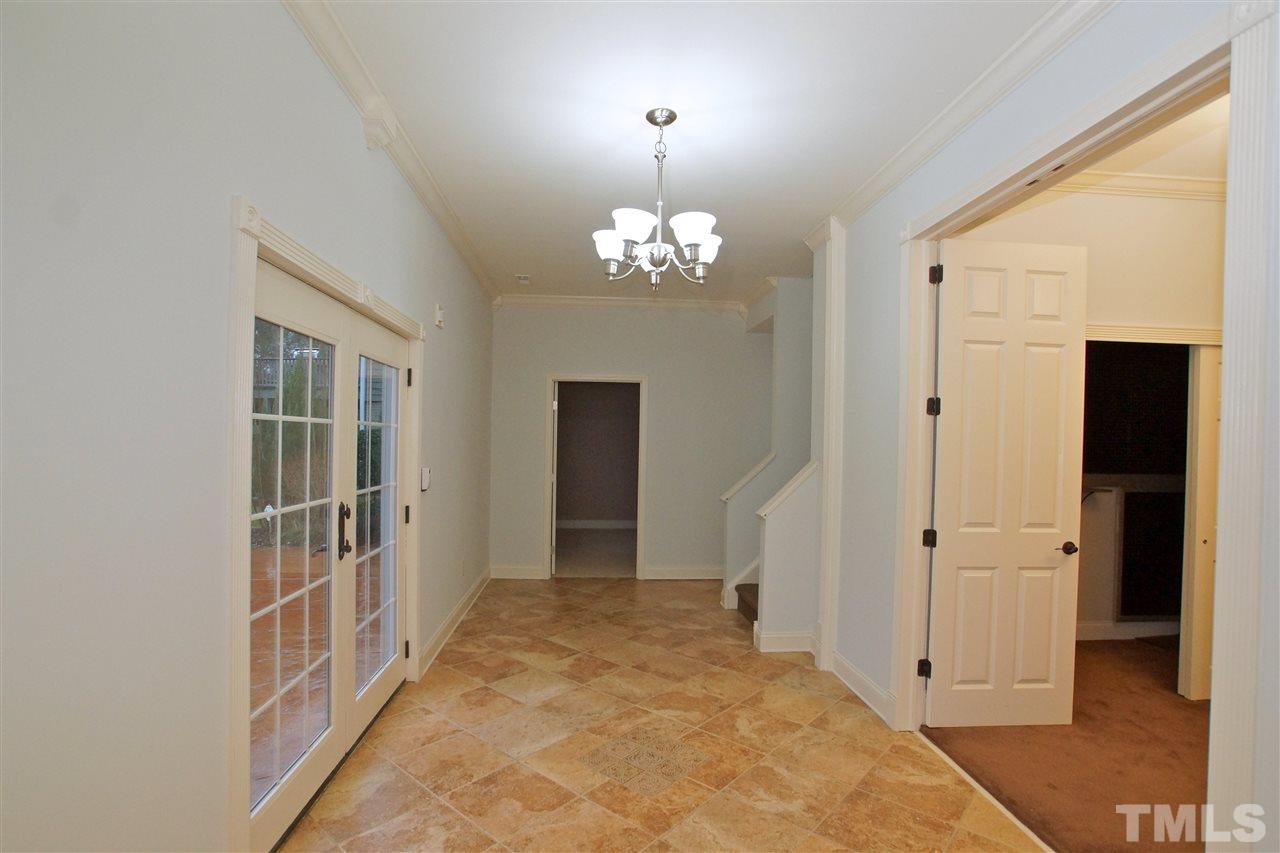9801 Crooked Tree Lane Raleigh, NC 27617 - Photo 10 of 19 wooden floor with chandelier and closet