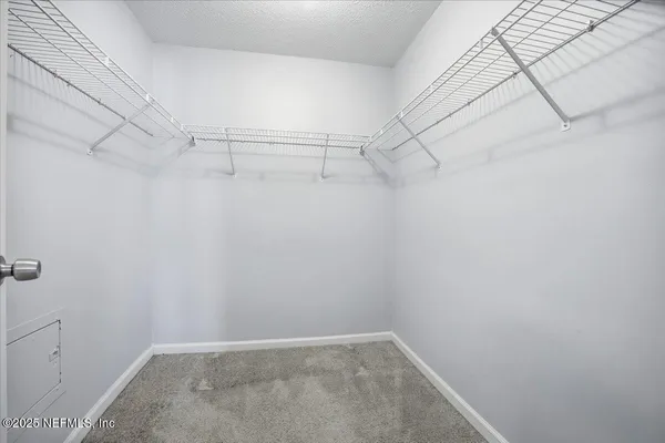 a view of a room with racks on the wall