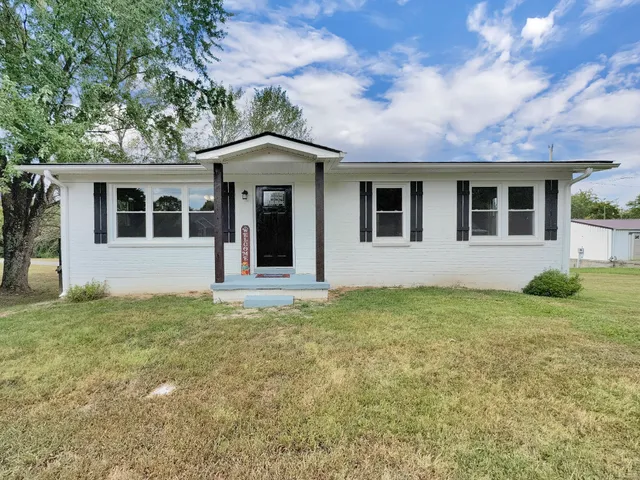 front view of a house with a yard