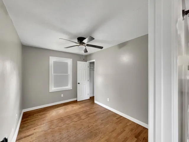 a view of an empty room with a window