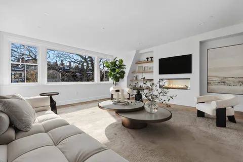 a bedroom with a large bed and a large window