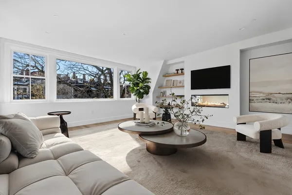 a bedroom with a large bed and a large window