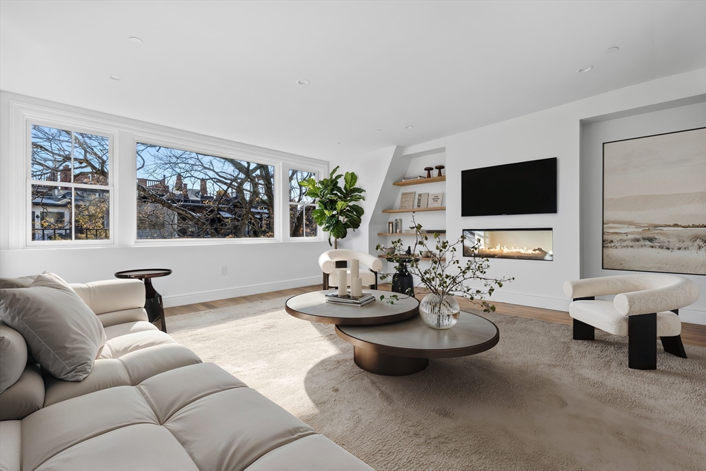 18 Milford Street, Unit 2 Boston, MA 02118 - Photo 3 of 4 a living room with furniture and a flat screen tv