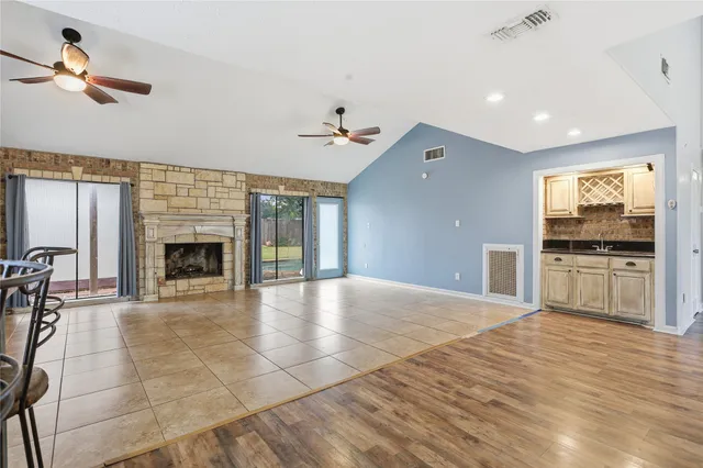 a view of a livingroom with furniture wooden floor and windows