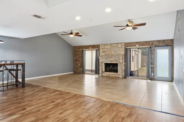 a aerial view of a house with a yard