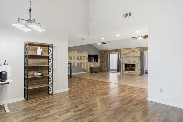 a view of an empty room with a fireplace