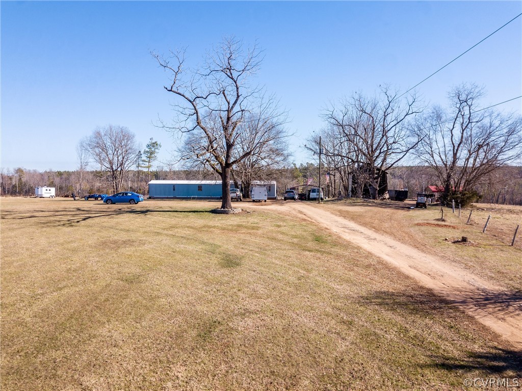 14667 Baltimore Road Dewitt, VA 23840 - Photo 4 of 17 a view of road with large trees