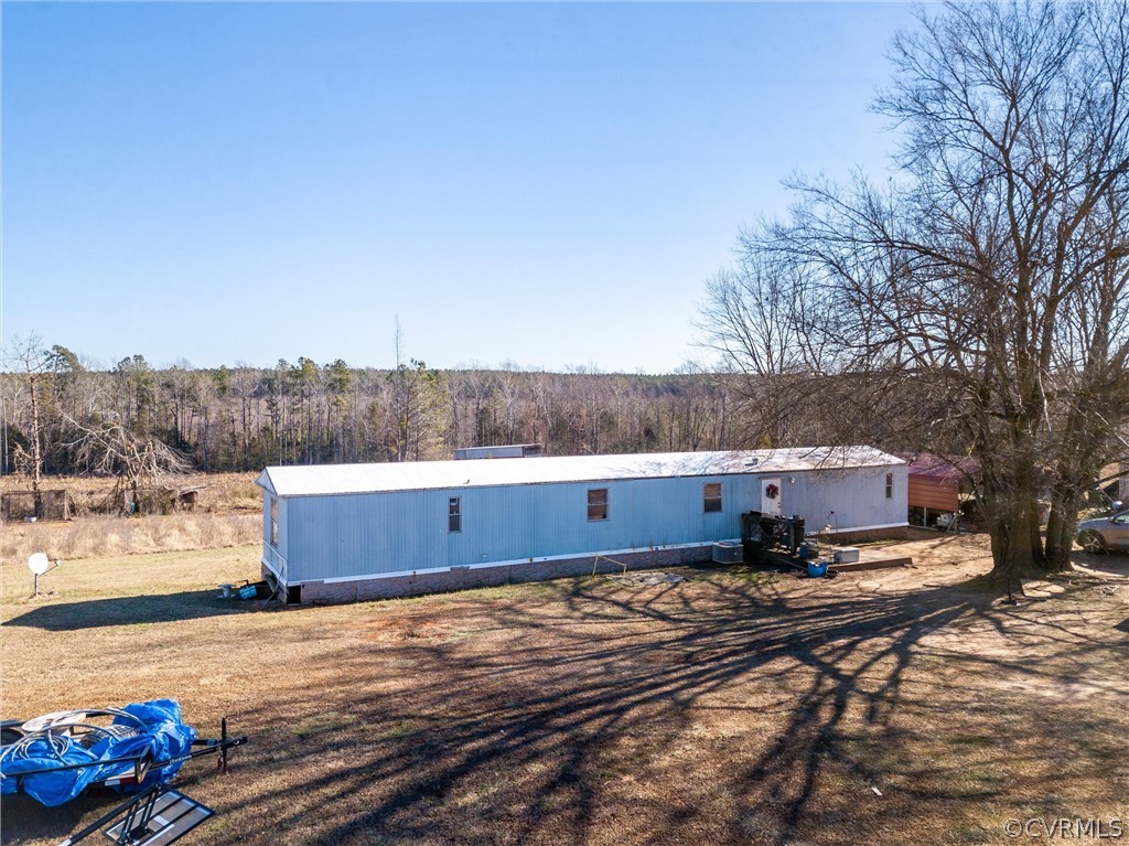 14667 Baltimore Road Dewitt, VA 23840 - Photo 5 of 17 a view of a yard with wooden fence