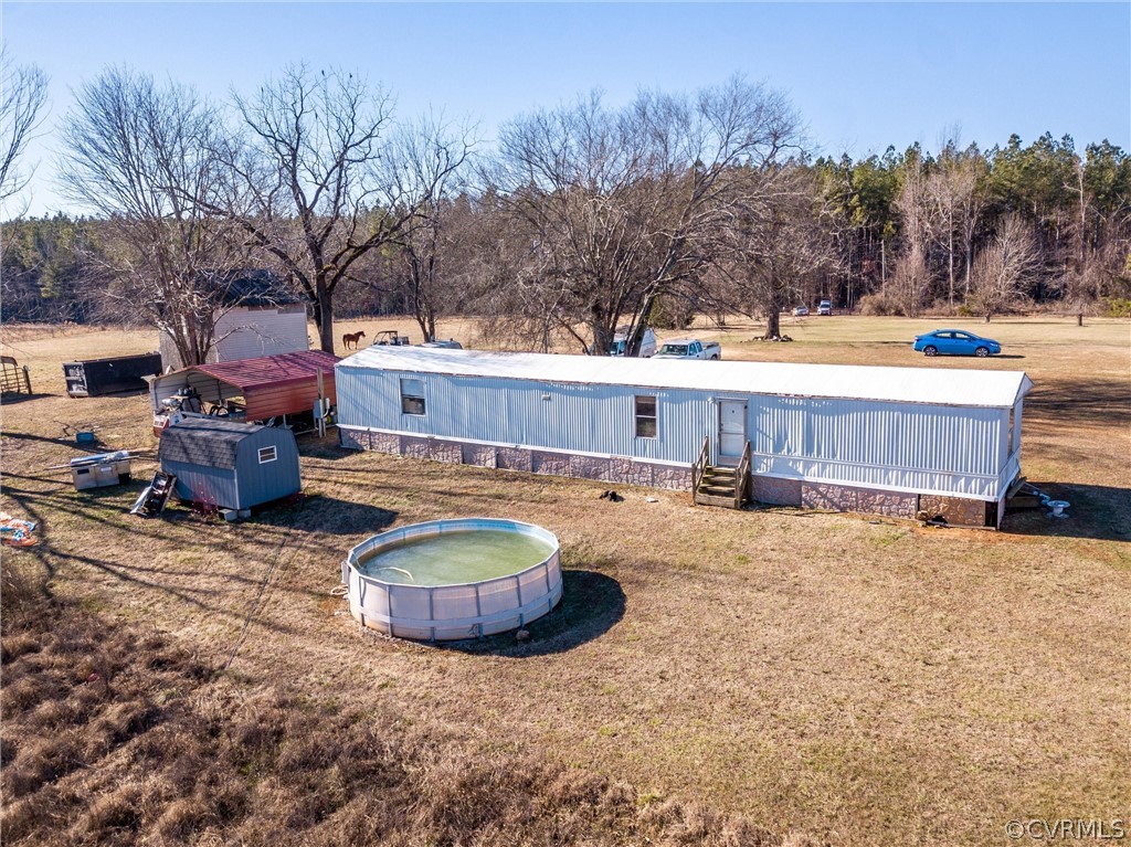 14667 Baltimore Road Dewitt, VA 23840 - Photo 6 of 17 a swimming pool with outdoor seating and yard