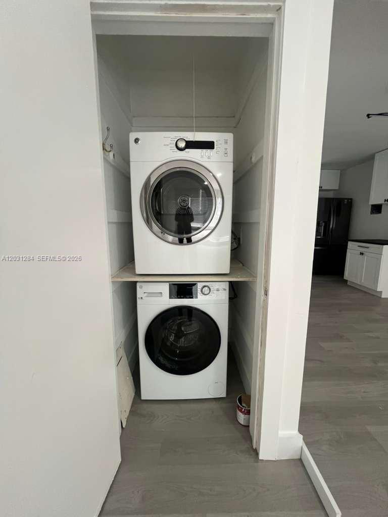 316 Surfside Boulevard, Unit 2 Surfside, FL 33154 - Photo 12 of 13 a utility room with dryer and washer