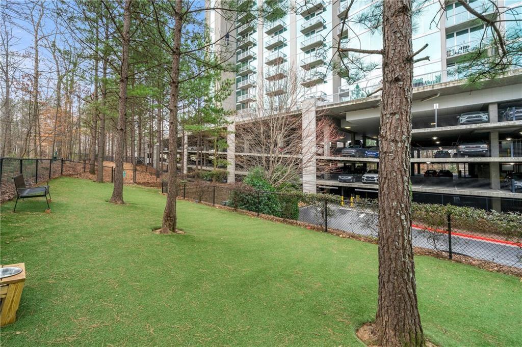 3300 Windy Ridge Parkway Southeast, Unit 1112 Atlanta, GA 30339 - Photo 29 of 43 a view of a park with swings and a bench
