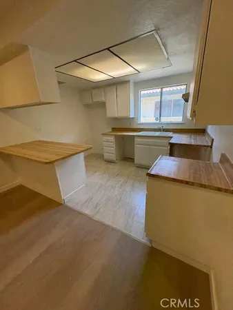 a kitchen with counter top space and appliances