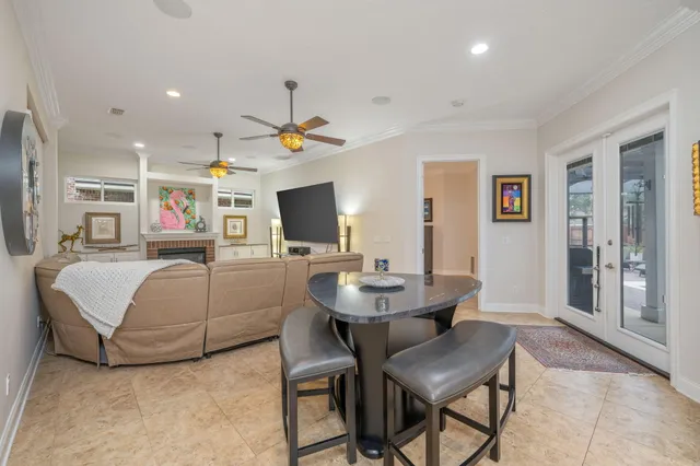 a kitchen with kitchen island granite countertop wooden cabinets stainless steel appliances a sink and a center island