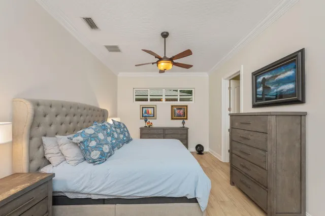 a spacious bedroom with a bed and a shower