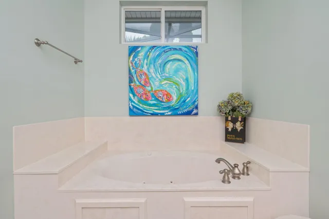 a view of walk in closet with clothes