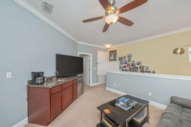 a view of a porch with a table and chairs