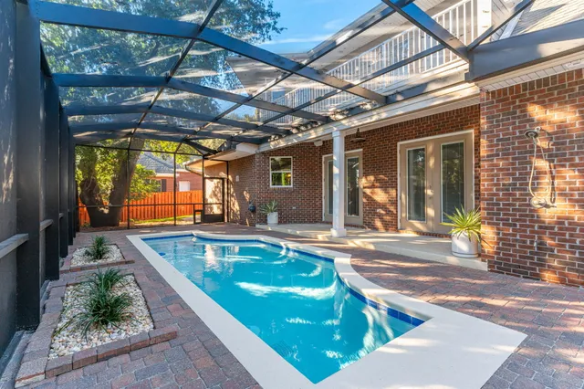 an aerial view of a house with a lake view
