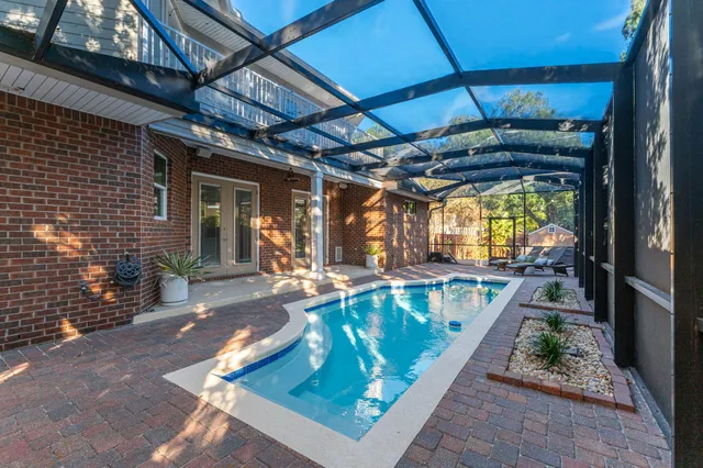 an aerial view of a house with garden space and street view