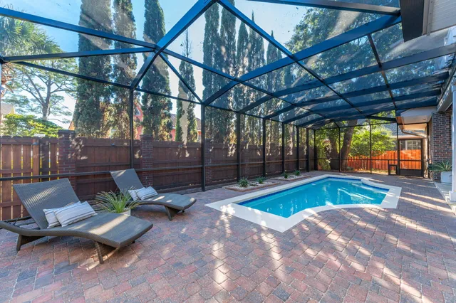 a view of a house with a yard and garden