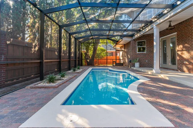 an aerial view of a house swimming pool and outdoor space