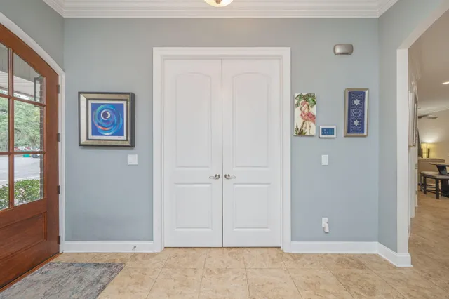 a kitchen with granite countertop stainless steel appliances a sink a counter top space cabinets and a window