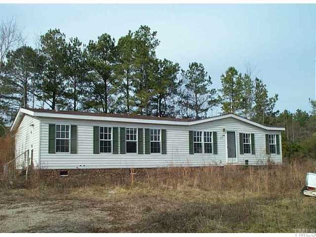 300 Ave B Spring Hope, NC 27882 - Photo 1 of 1 a front view of a house with a garden