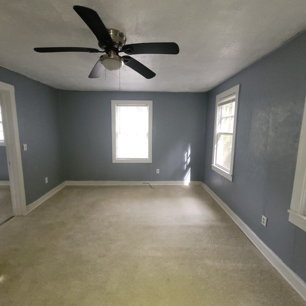 5709 Hodges Drive, Unit 4 Columbus, GA 31909 - Photo 6 of 7 a view of an empty room with a window