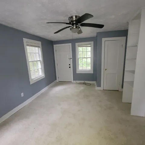a view of an empty room with a window